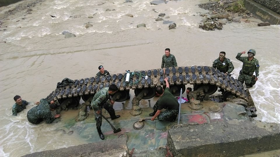 Three dead, one injured after tank topples into river