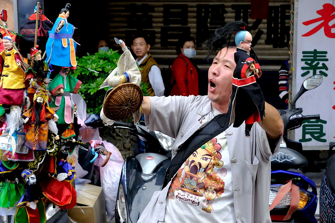 A cloth puppet theater performance on a street in Taipei